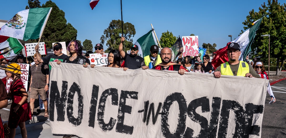 Protesters Fill Oceanside Intersection to Oppose ICE Activity